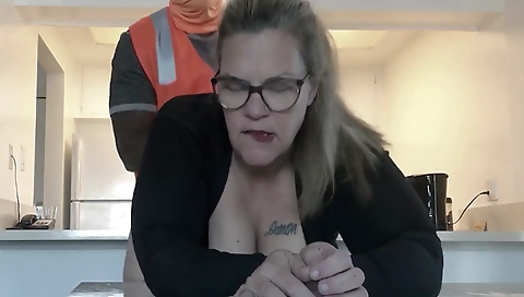Mature woman rides a black cock of a construction worker