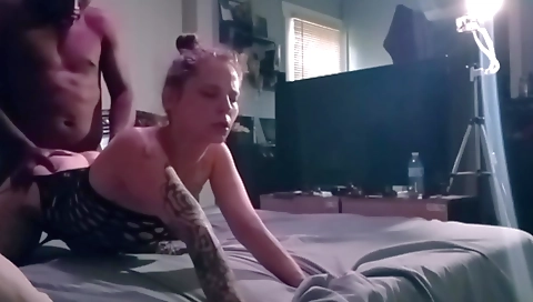 Brunette girl sucks on the camera lens in amateur video