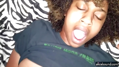 Hairy ebony woman in a black dress and stockings with hairy tits