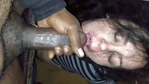 Horny brunette milf with a big cock sucking a big dick